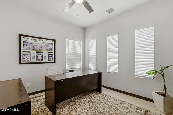 a bedroom with furniture and a window