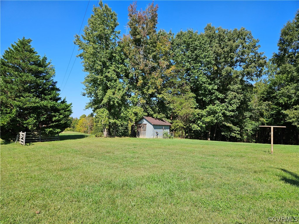 11310 Clement Town Road Amelia Court House, VA 23002 - Photo 12 of 32 a view of a field with trees in the background