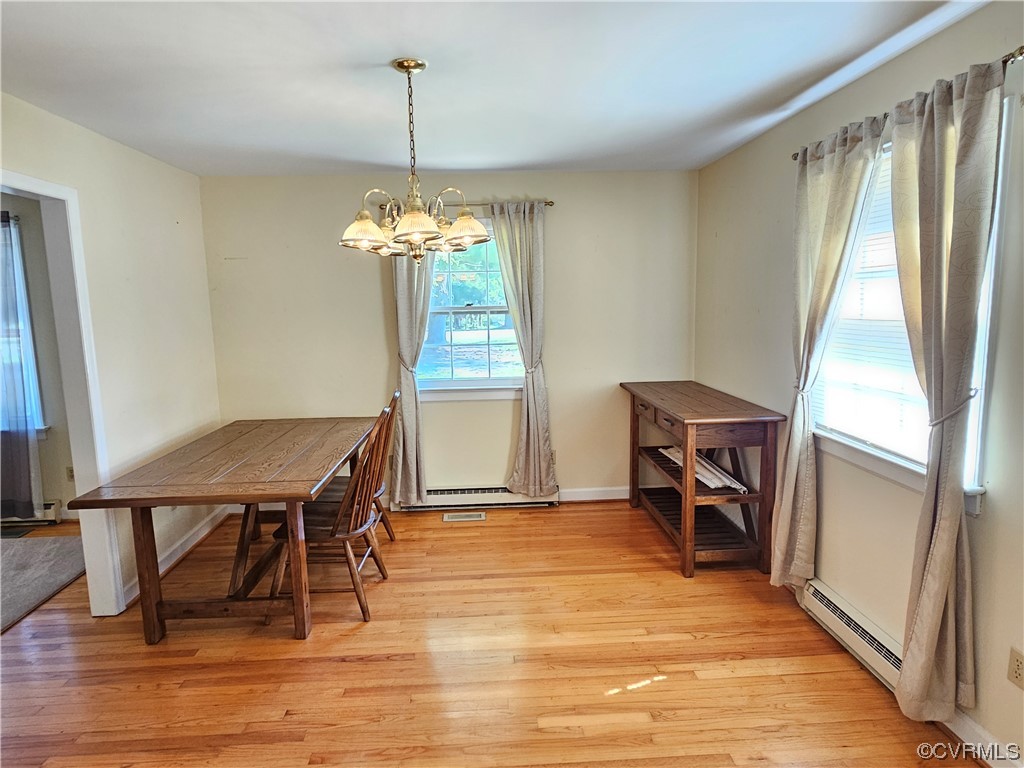 11310 Clement Town Road Amelia Court House, VA 23002 - Photo 17 of 32 a view of a dining room with furniture window and wooden floor