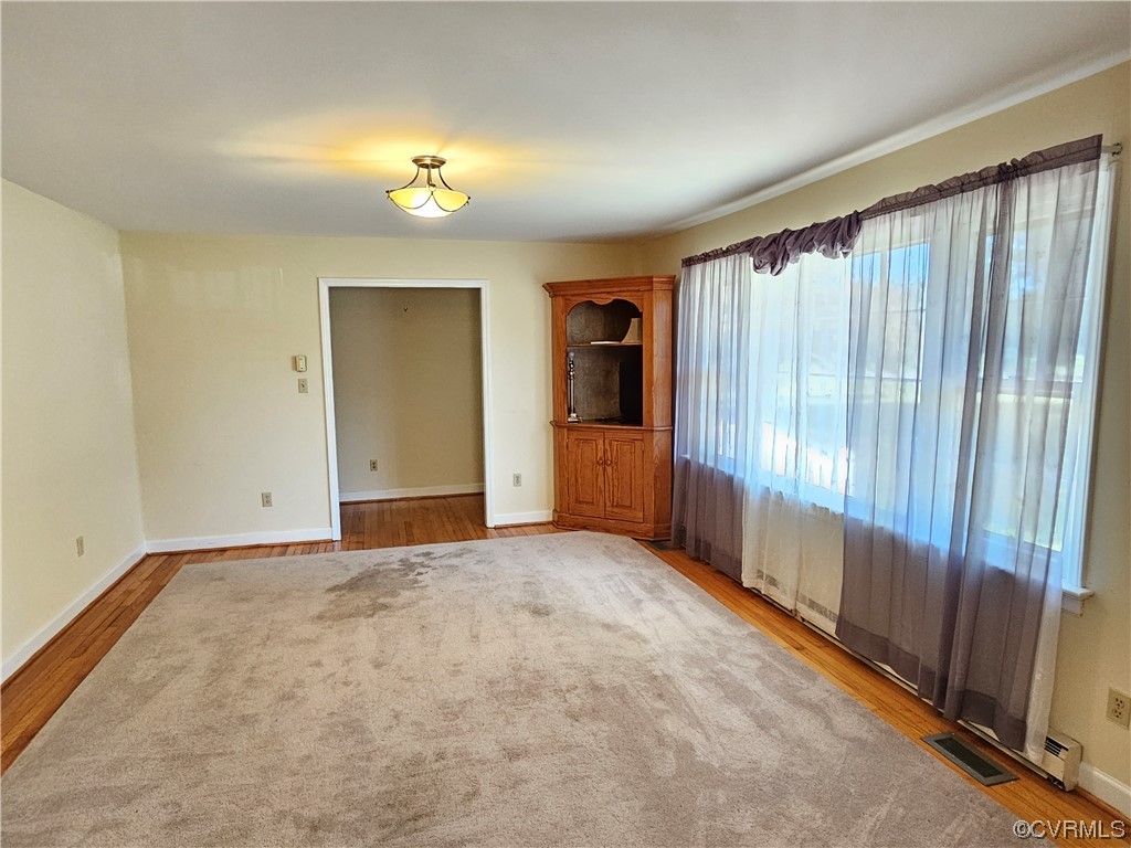 11310 Clement Town Road Amelia Court House, VA 23002 - Photo 20 of 32 wooden floor in an empty room with a window