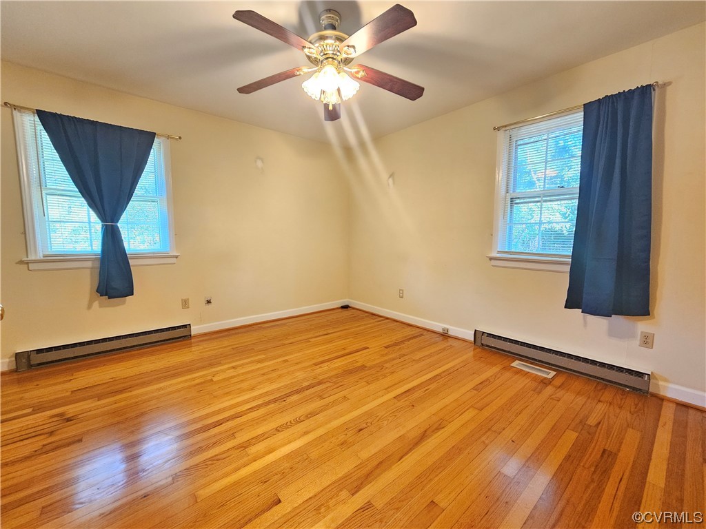 11310 Clement Town Road Amelia Court House, VA 23002 - Photo 21 of 32 wooden floor in an empty room with a window
