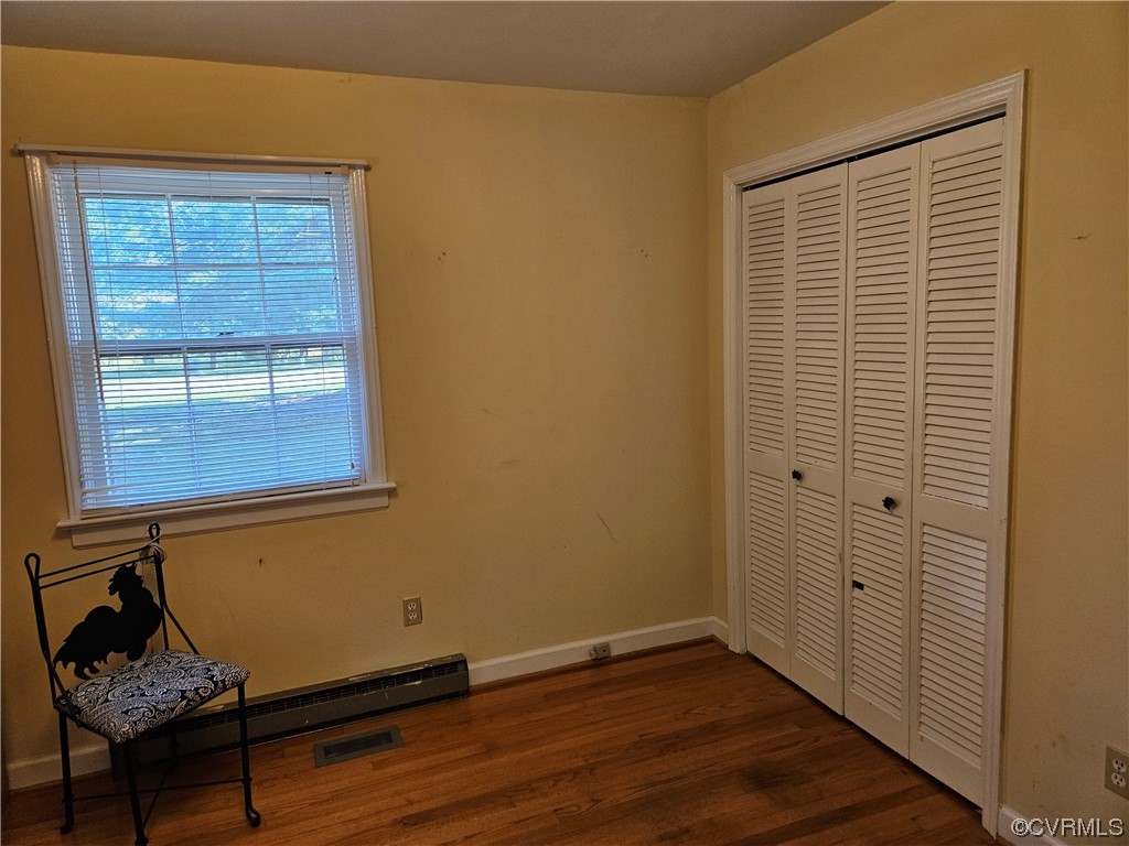 11310 Clement Town Road Amelia Court House, VA 23002 - Photo 25 of 32 a room with wooden floor and a window
