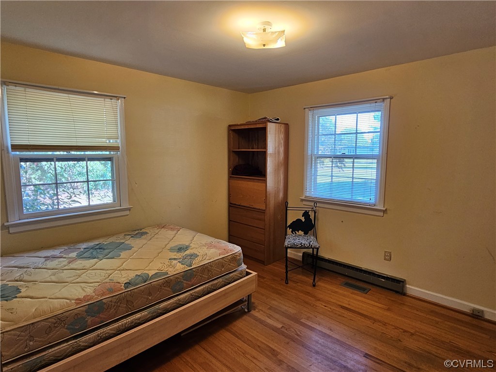 11310 Clement Town Road Amelia Court House, VA 23002 - Photo 26 of 32 a bedroom with a bed and a window