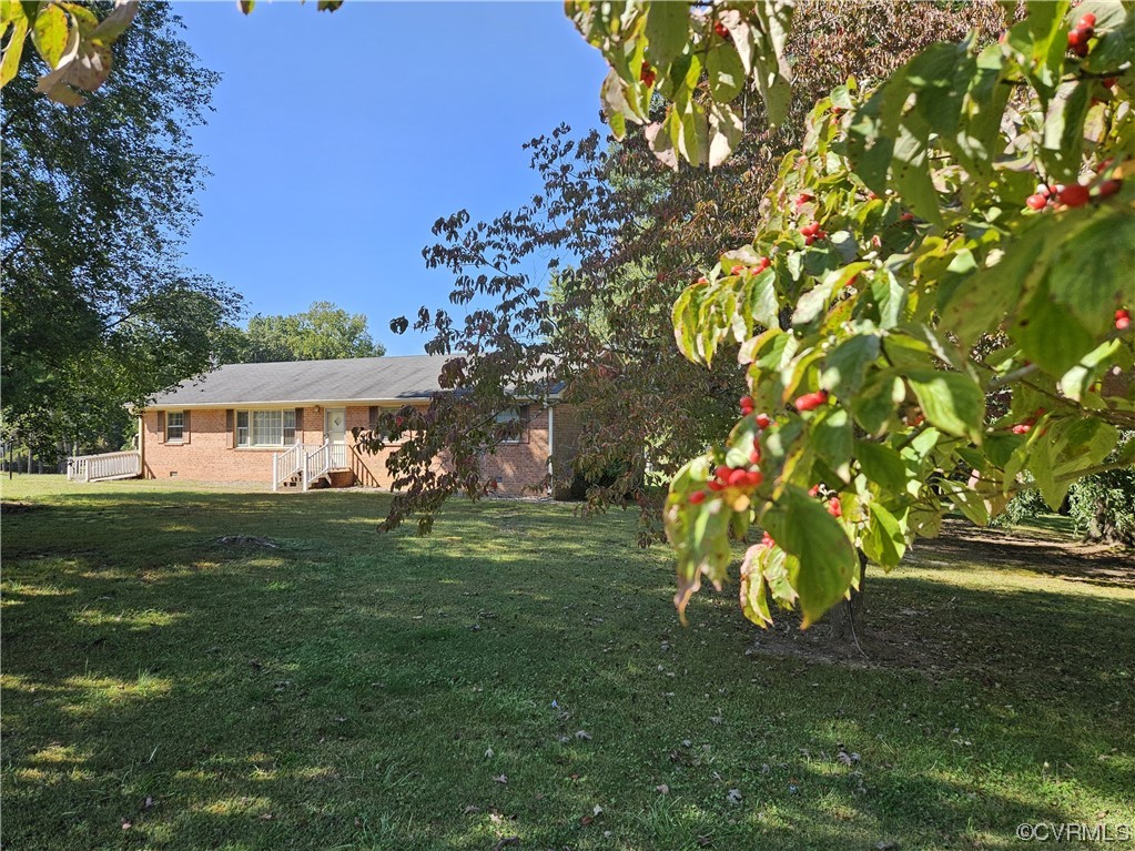 11310 Clement Town Road Amelia Court House, VA 23002 - Photo 3 of 32 a view of a house with a yard