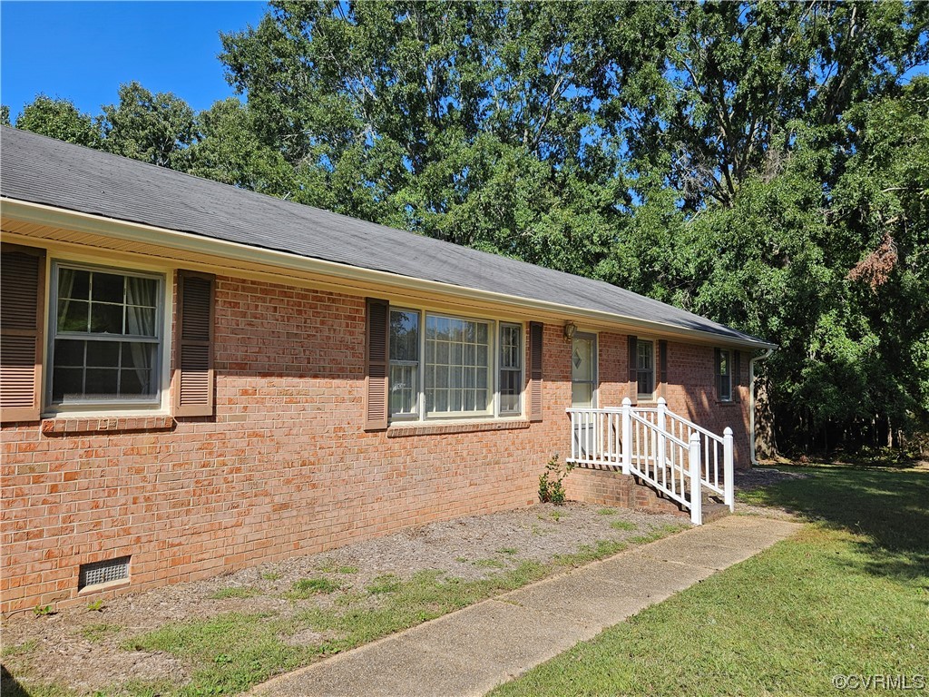 11310 Clement Town Road Amelia Court House, VA 23002 - Photo 5 of 32 a front view of a house with a yard