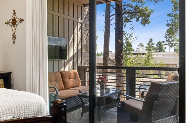 a balcony with furniture and a window