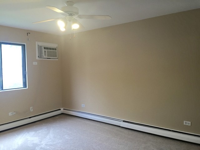 12 Parkside Court, Unit 4 Vernon Hills, IL 60061 - Photo 9 of 16 an empty room with a empty space and window