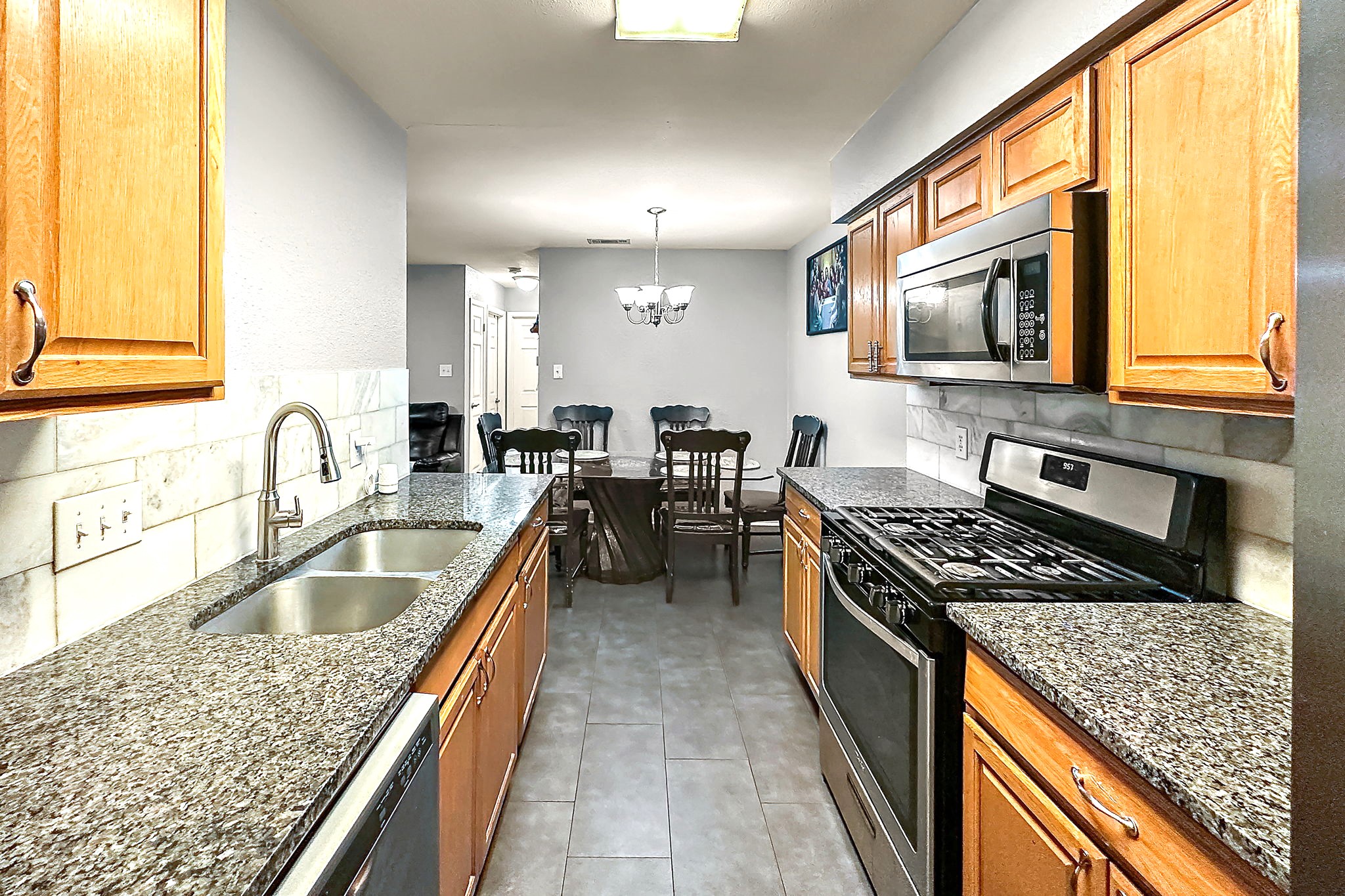 700 Misty Morning Way Round Rock, TX 78664 - Photo 10 of 36 Unit B - A well-appointed kitchen features ample cabinetry, granite counters, and stainless steel appliances.