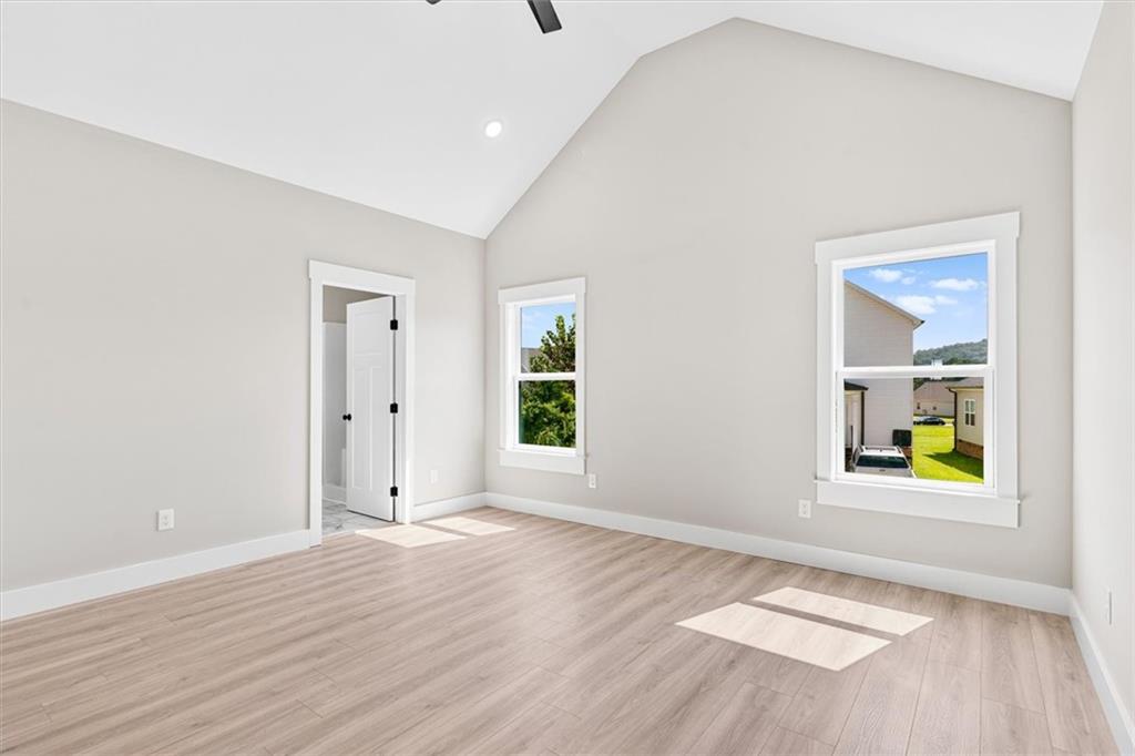 152 Washington Street Dalton, GA 30721 - Photo 20 of 40 an empty room with window and wooden floor