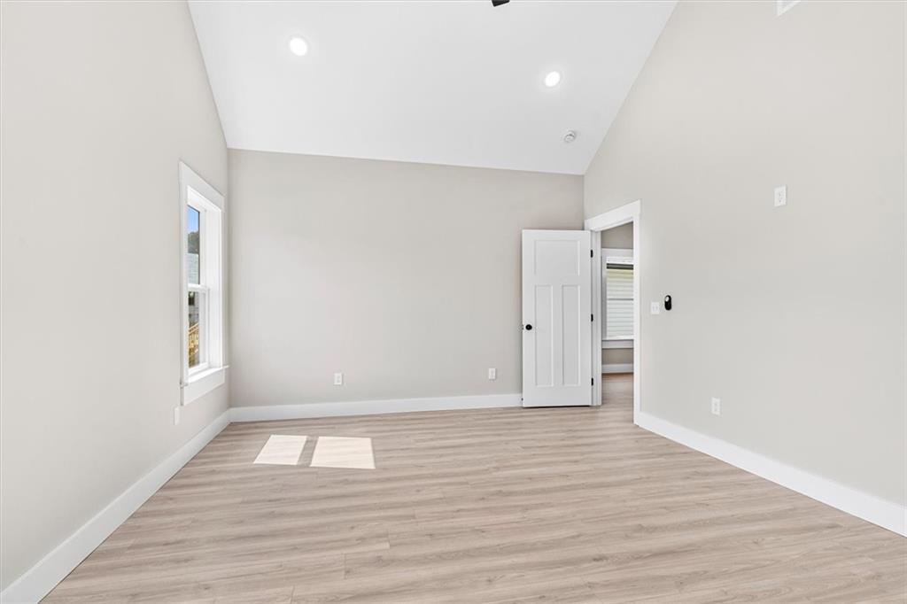 152 Washington Street Dalton, GA 30721 - Photo 26 of 40 a view of an empty room with wooden floor