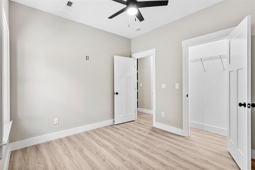 152 Washington Street Dalton, GA 30721 - Photo 29 of 40 a view of an empty room with wooden floor