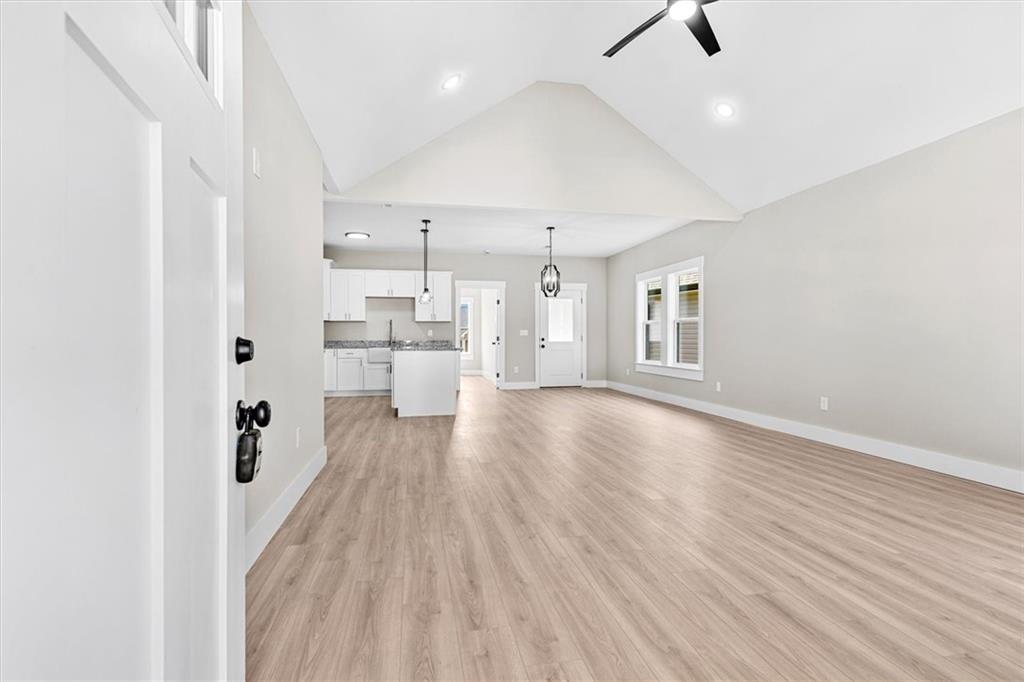152 Washington Street Dalton, GA 30721 - Photo 6 of 40 wooden floor in an empty room with a window