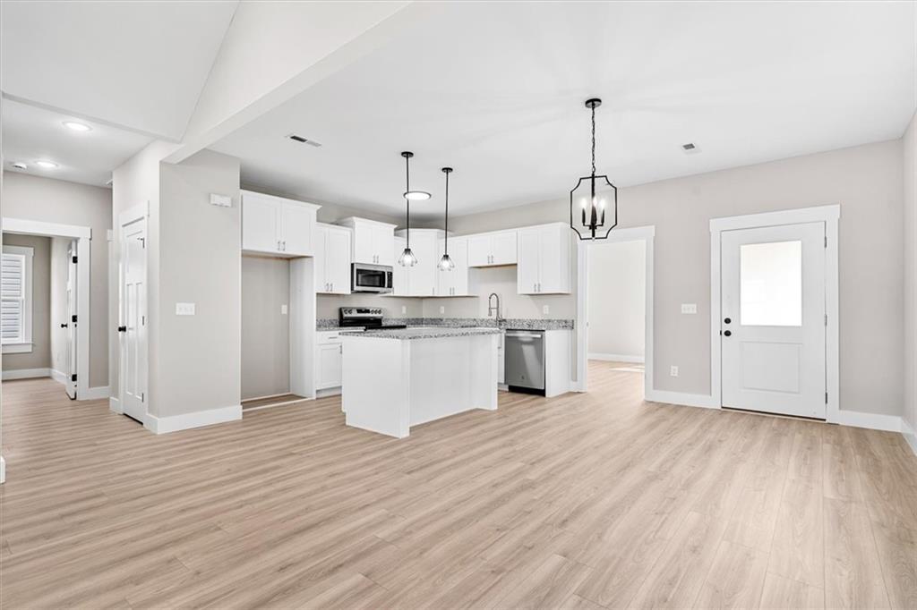 152 Washington Street Dalton, GA 30721 - Photo 9 of 40 a view of kitchen with granite countertop cabinets and refrigerator