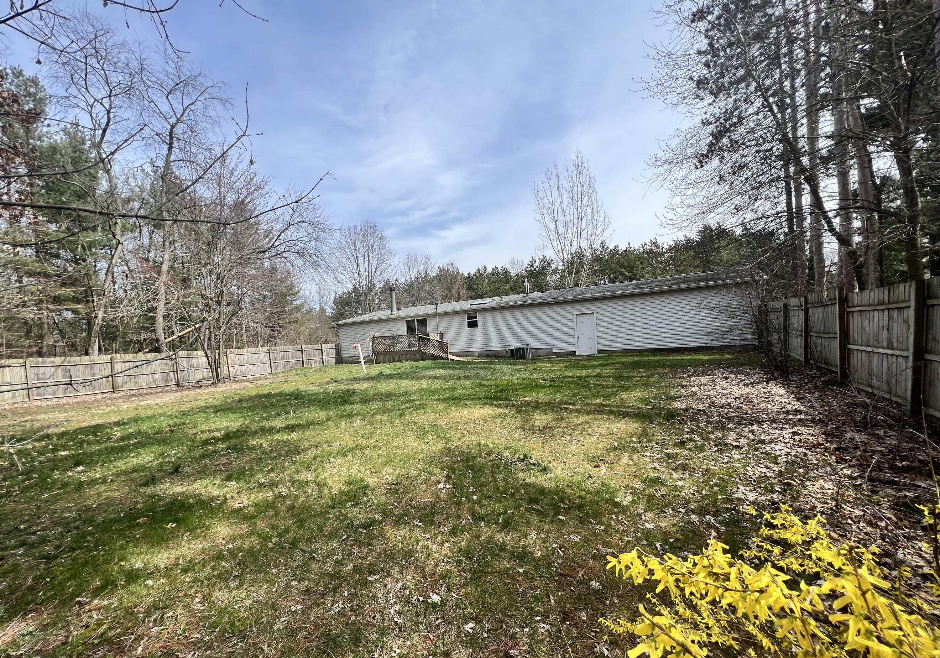1483 South Sullivan Road Ravenna, MI 49451 - Photo 6 of 32 Fenced backyard