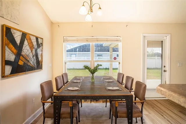 a view of a dining room with furniture and window