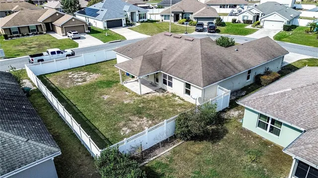 an aerial view of a house with a garden and plants
