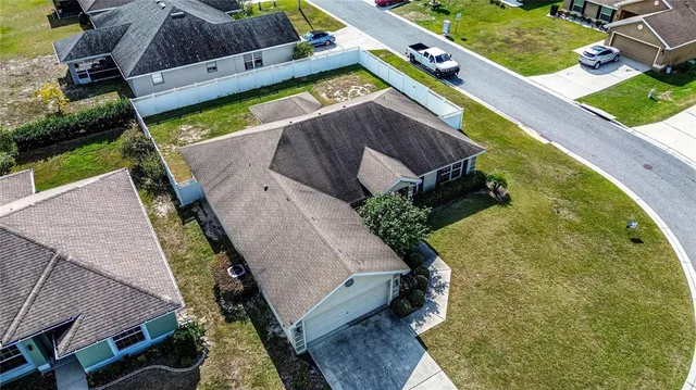 an aerial view of a house with outdoor space