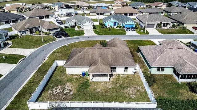 an aerial view of a house with swimming pool
