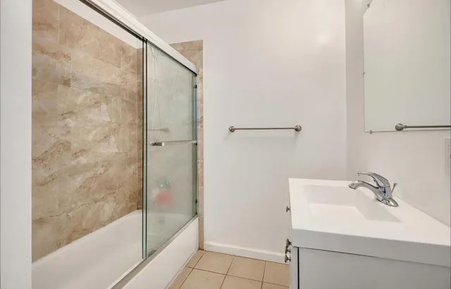 a bathroom with a sink and a shower