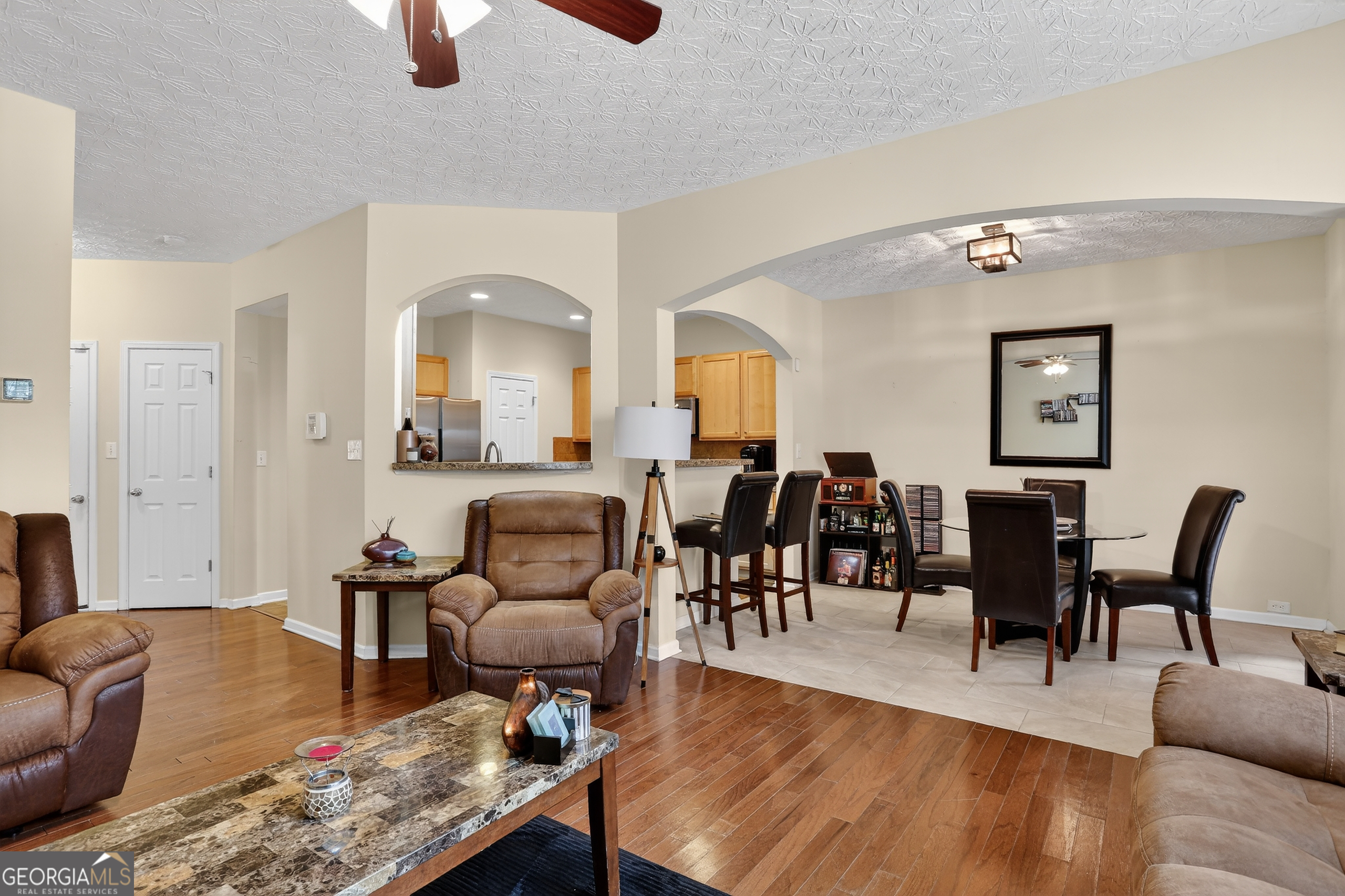 5556 Cascade Run South Fulton, GA 30336 - Photo 12 of 35 a living room with furniture and wooden floor
