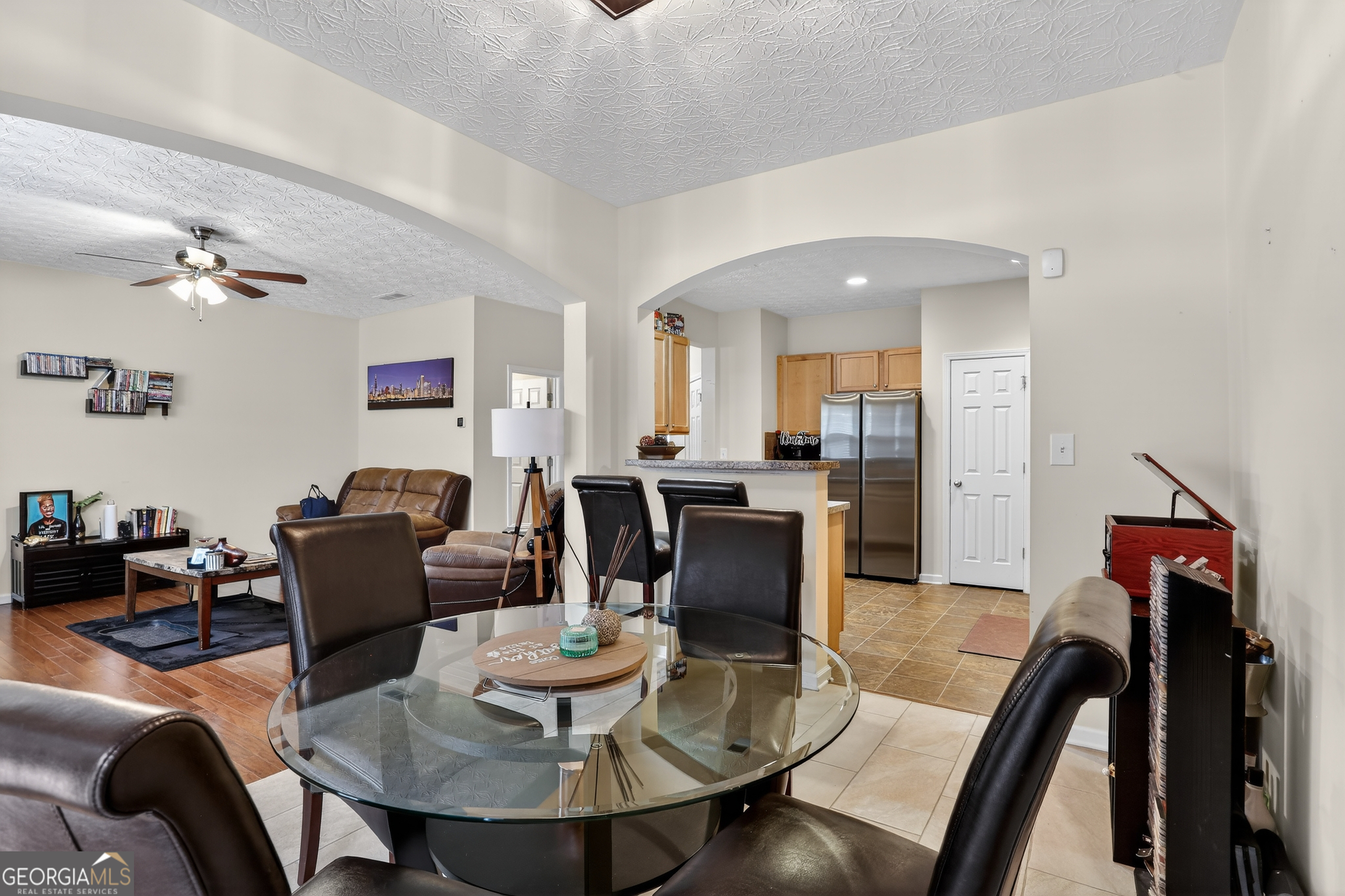5556 Cascade Run South Fulton, GA 30336 - Photo 13 of 35 a living room with furniture kitchen view and a dining table