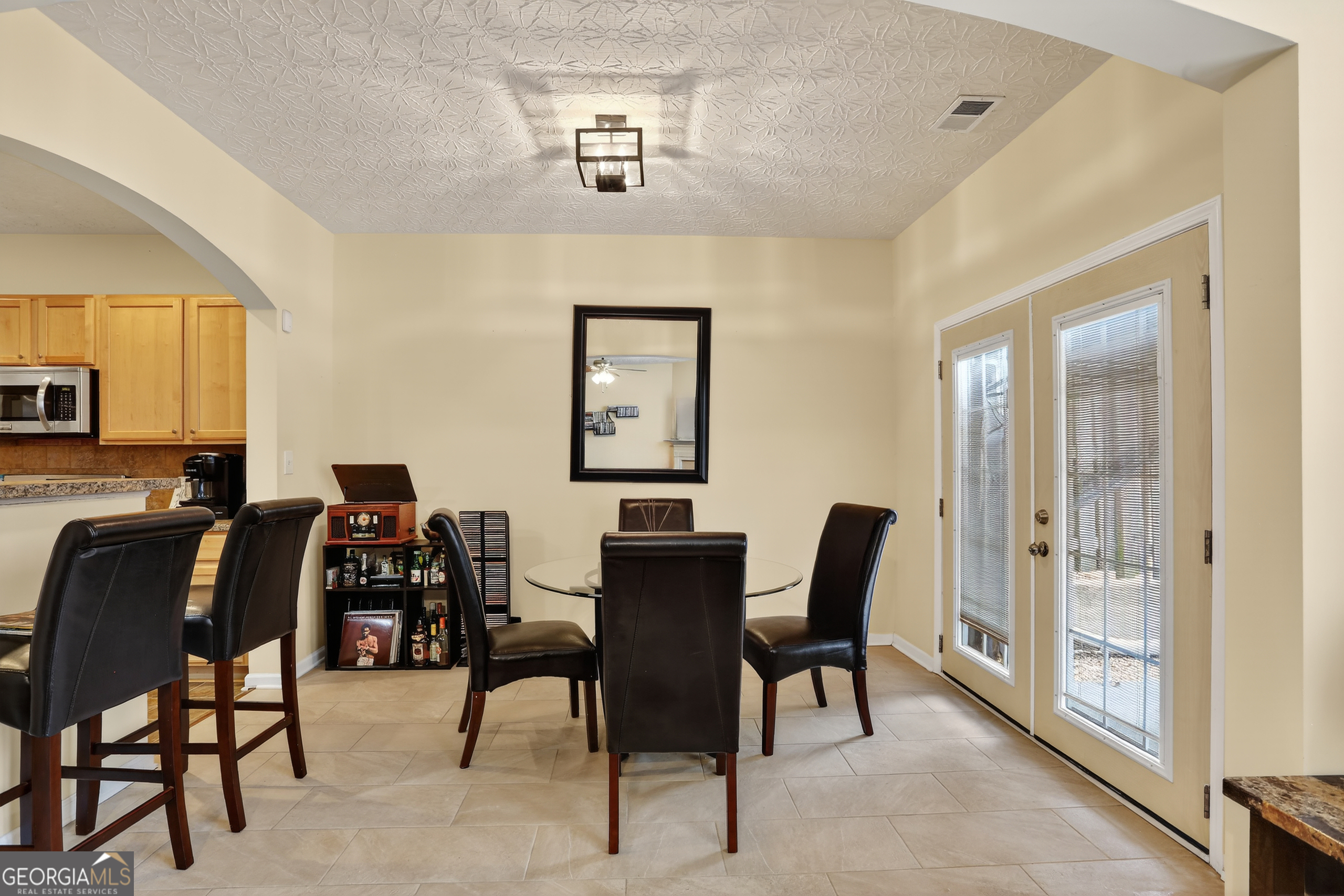 5556 Cascade Run South Fulton, GA 30336 - Photo 14 of 35 a view of a dining room with furniture and chandelier