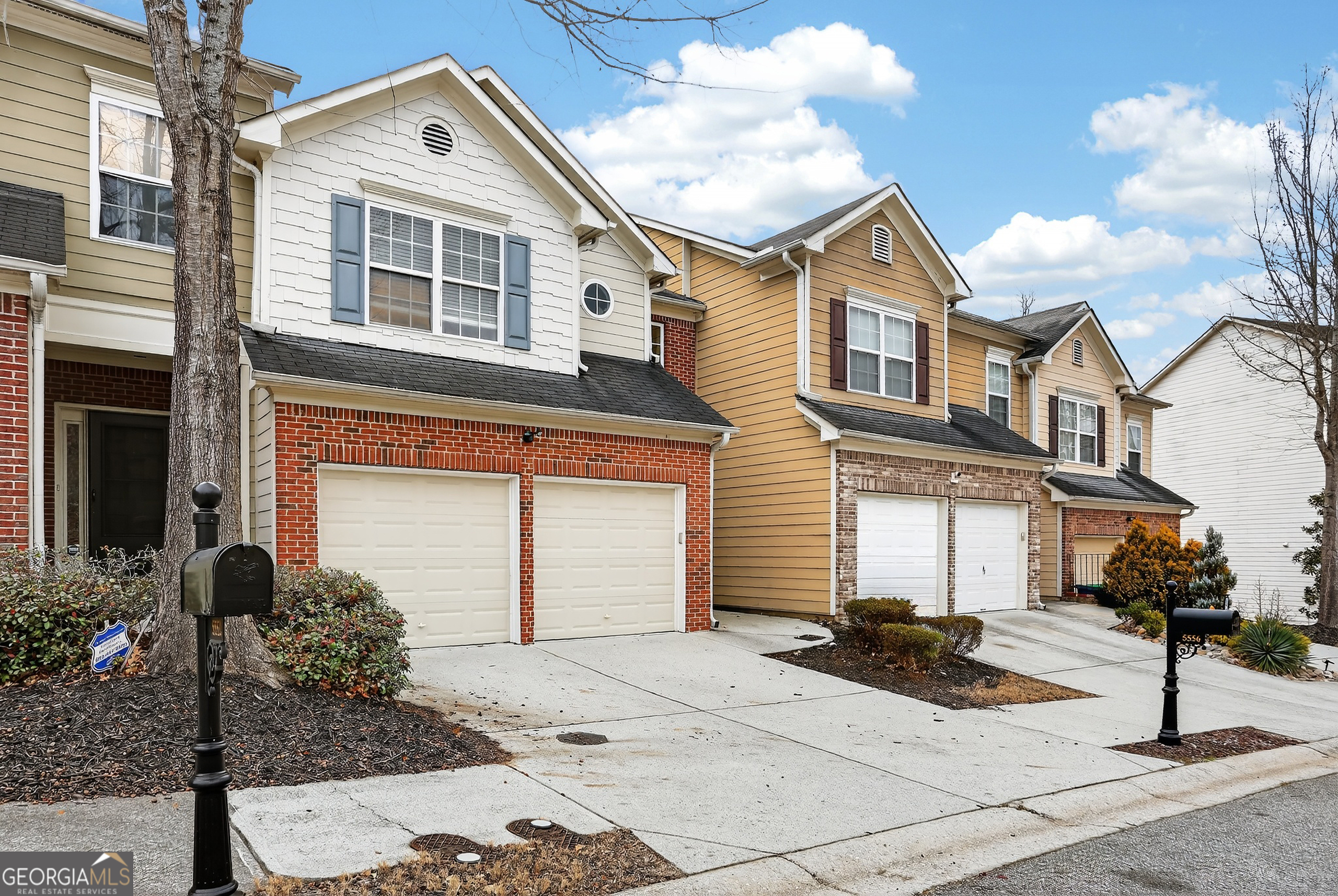 5556 Cascade Run South Fulton, GA 30336 - Photo 2 of 35 a front view of a house with a yard
