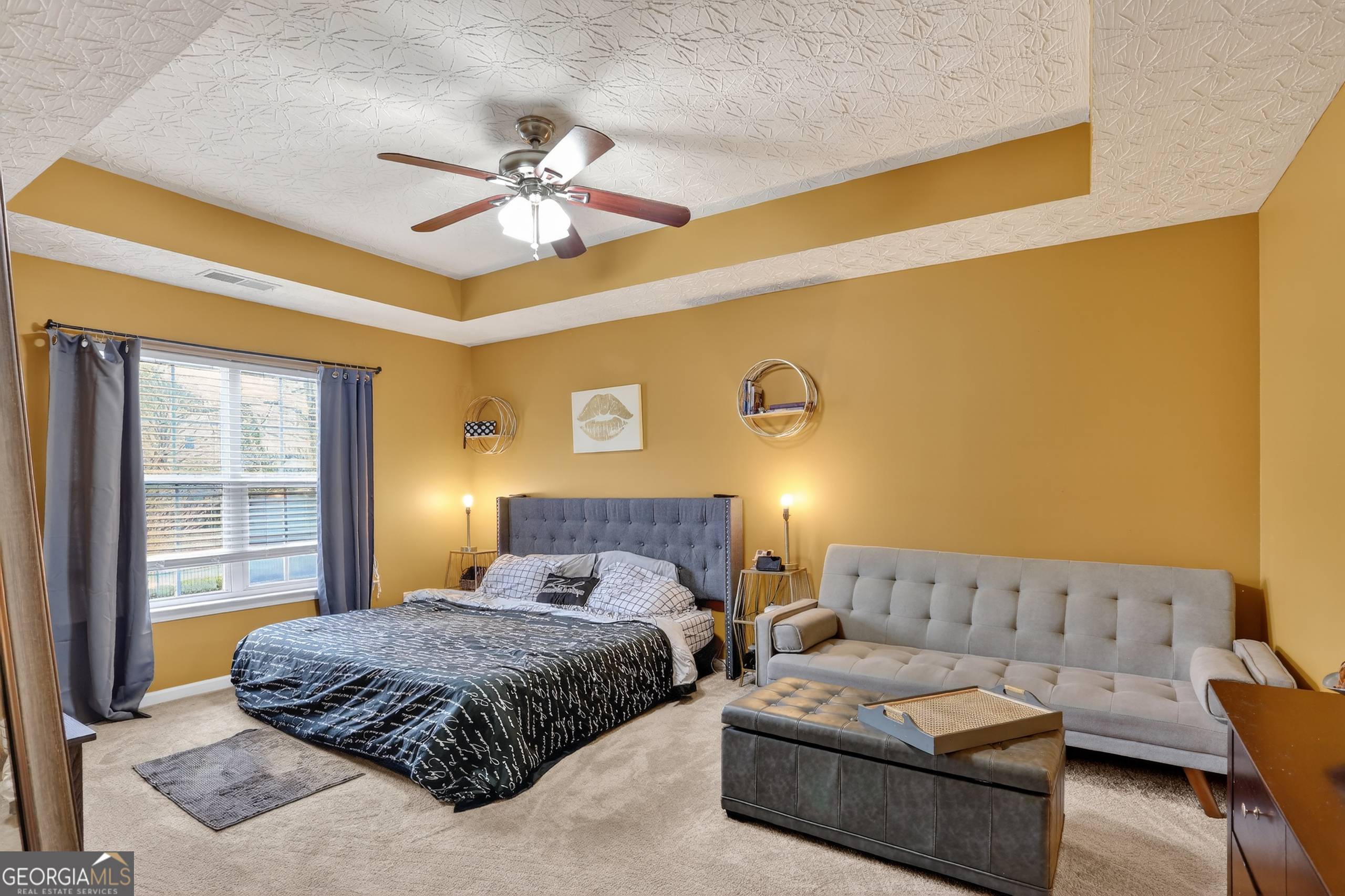5556 Cascade Run South Fulton, GA 30336 - Photo 24 of 35 a bedroom with a bed couch and window