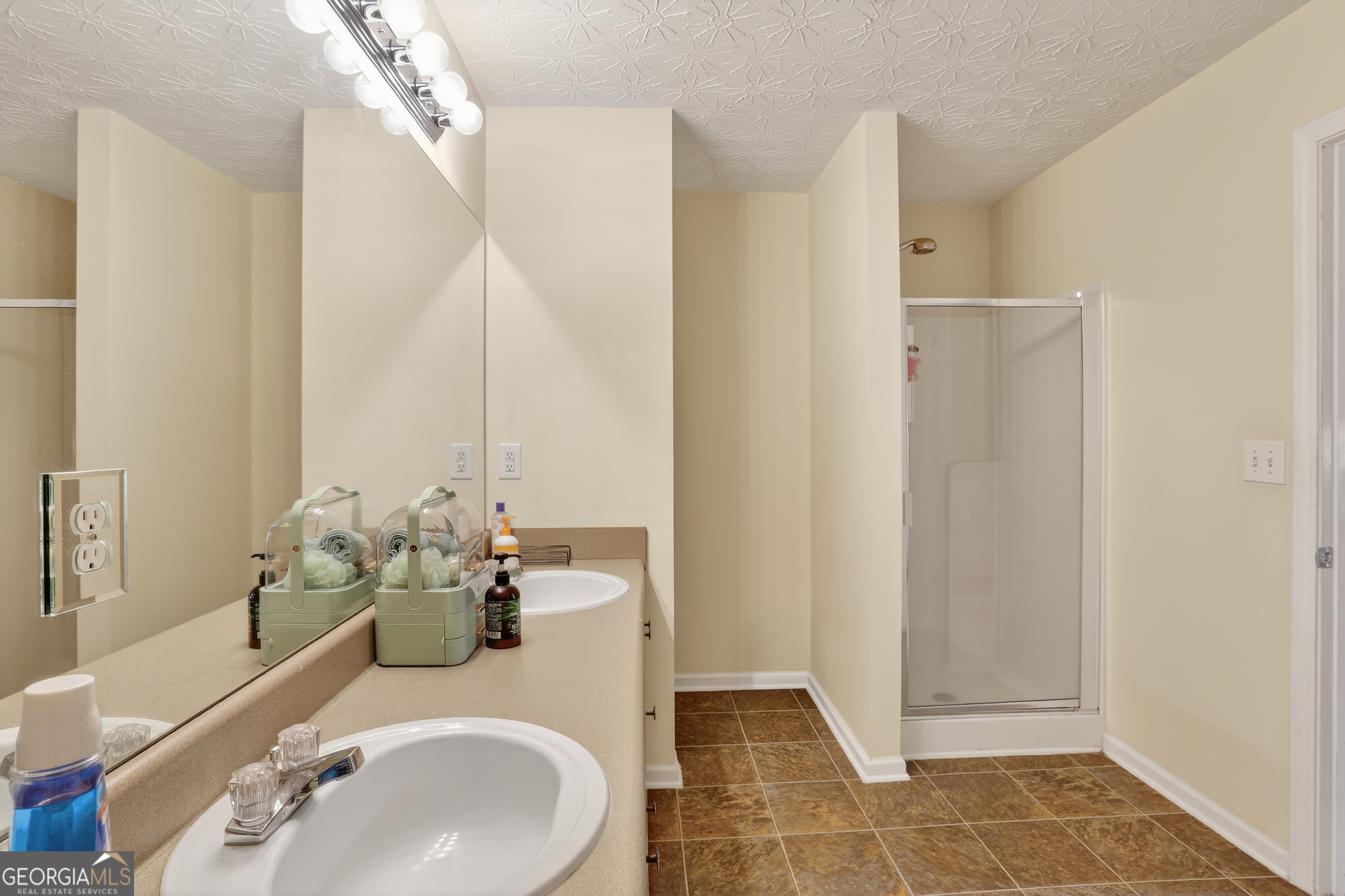 5556 Cascade Run South Fulton, GA 30336 - Photo 28 of 35 a bathroom with a sink and a mirror