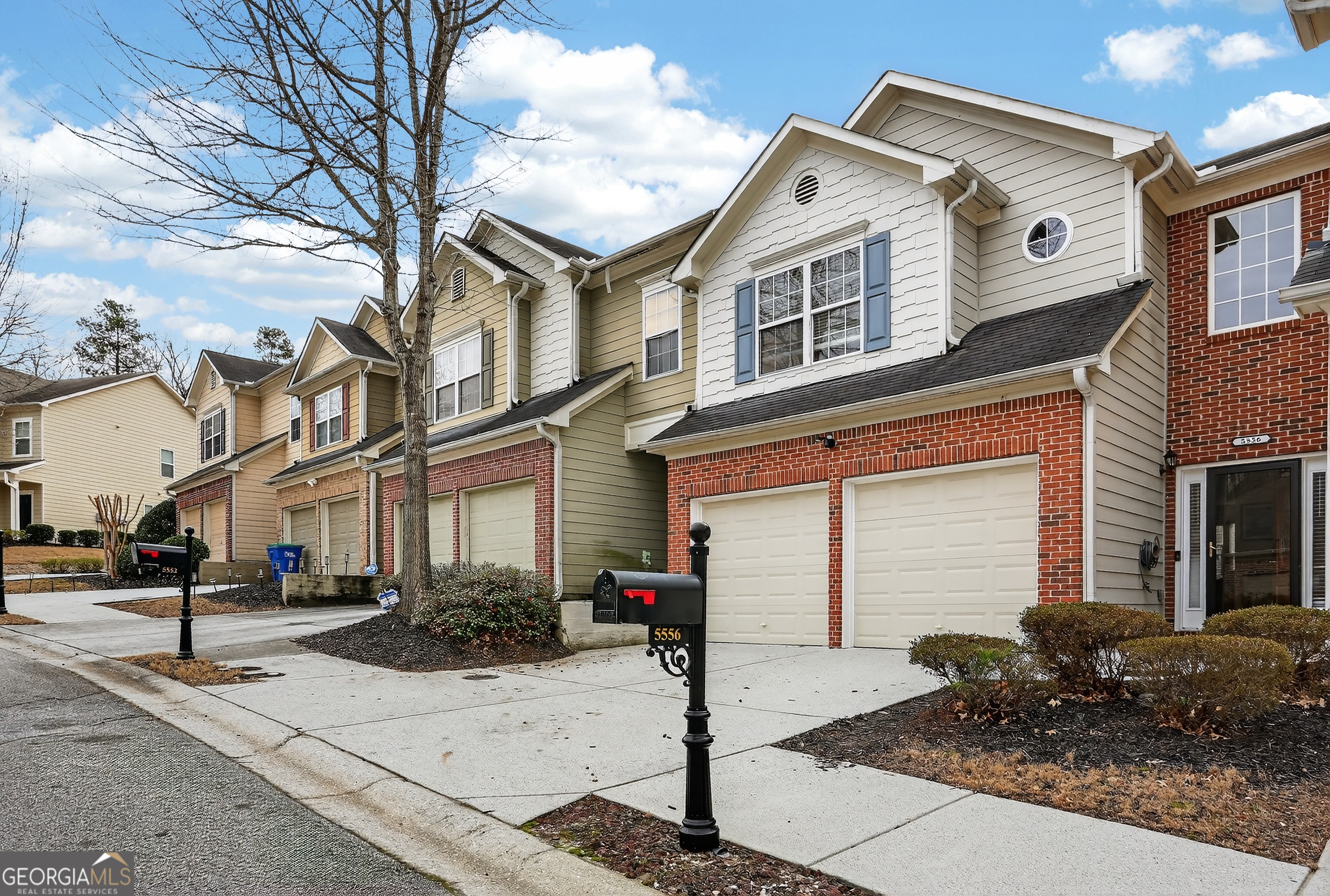 5556 Cascade Run South Fulton, GA 30336 - Photo 3 of 35 a front view of a building with street