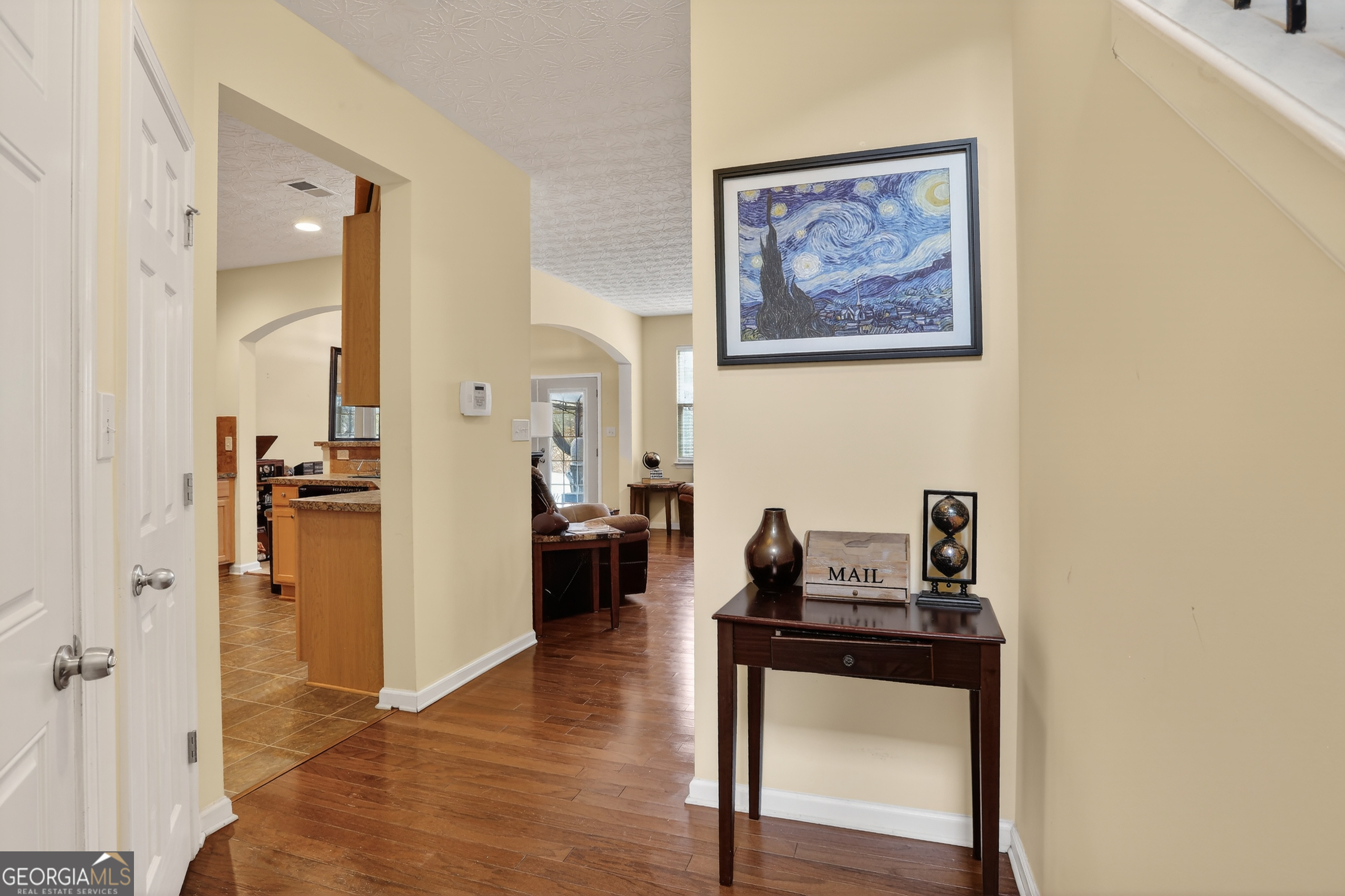 5556 Cascade Run South Fulton, GA 30336 - Photo 5 of 35 a living room with furniture and a wooden floor