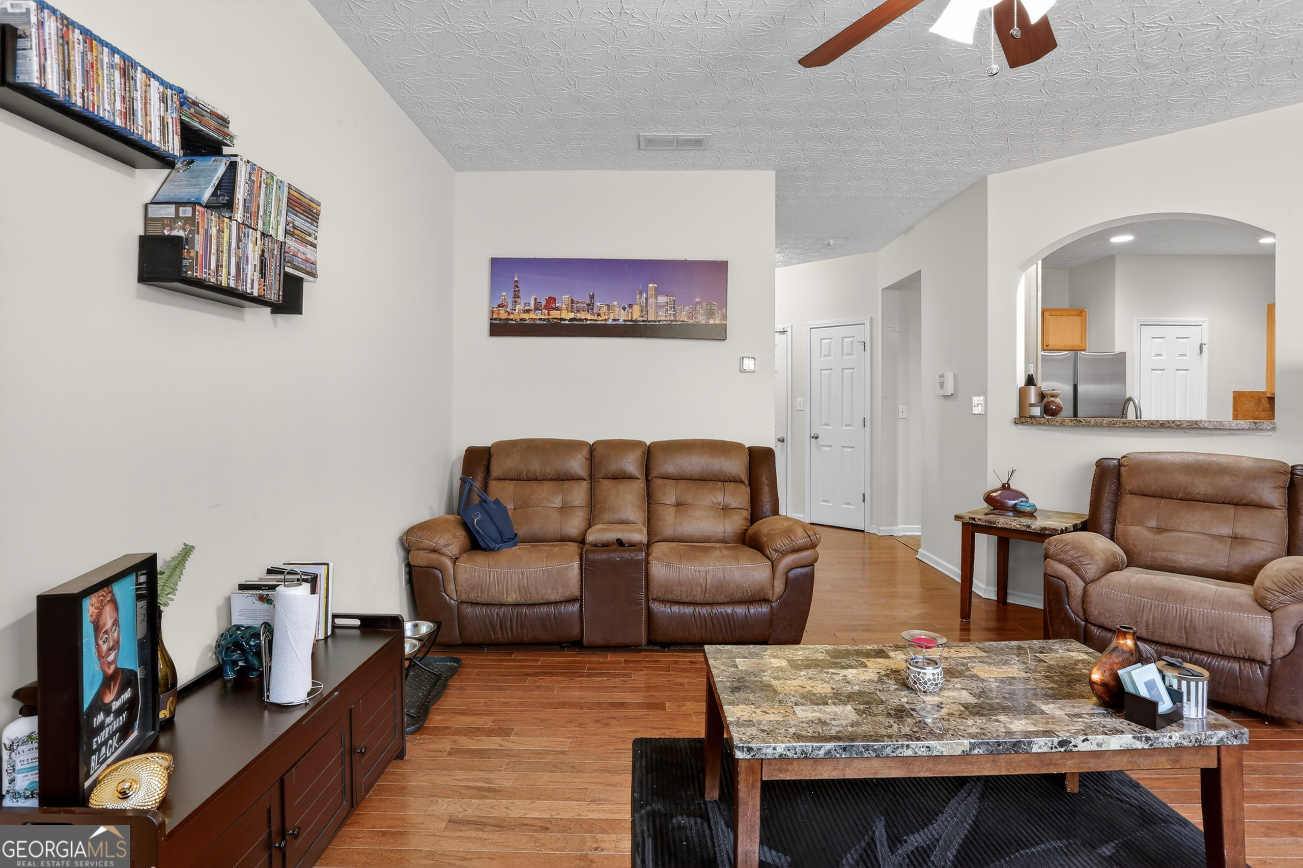 5556 Cascade Run South Fulton, GA 30336 - Photo 7 of 35 a living room with furniture and a couch