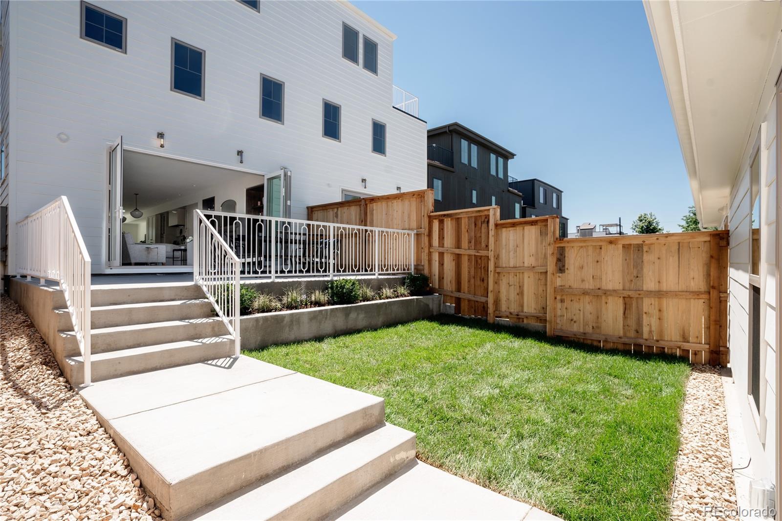 4131 Quivas Street Denver, CO 80211 - Photo 1 of 44 a view of yard with wooden fence