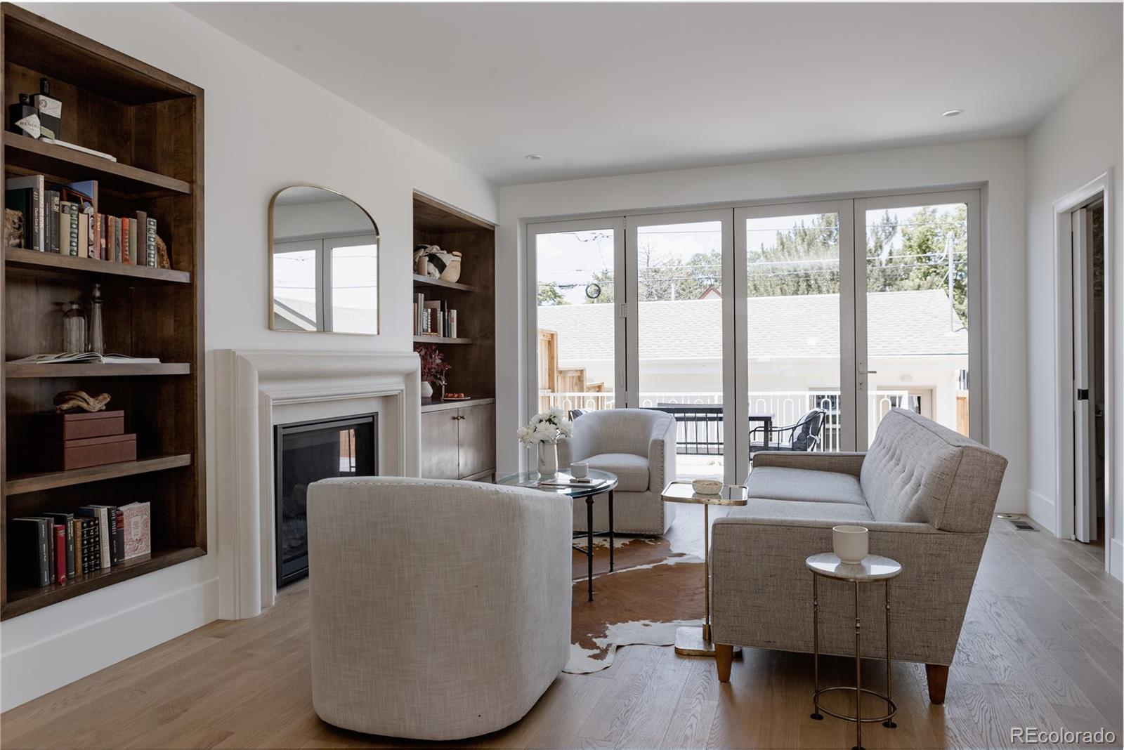 4131 Quivas Street Denver, CO 80211 - Photo 13 of 44 a living room with furniture and a fireplace