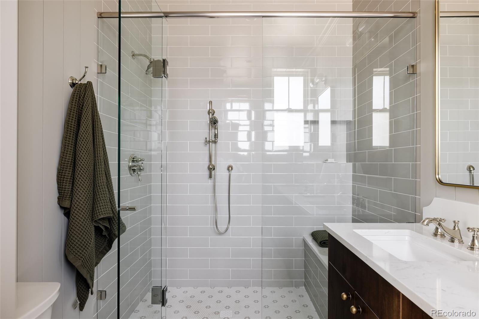 4131 Quivas Street Denver, CO 80211 - Photo 24 of 44 a bathroom with a sink vanity granite and shower