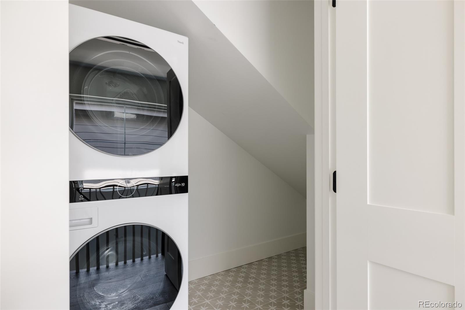 4131 Quivas Street Denver, CO 80211 - Photo 29 of 44 a utility room with dryer and washer