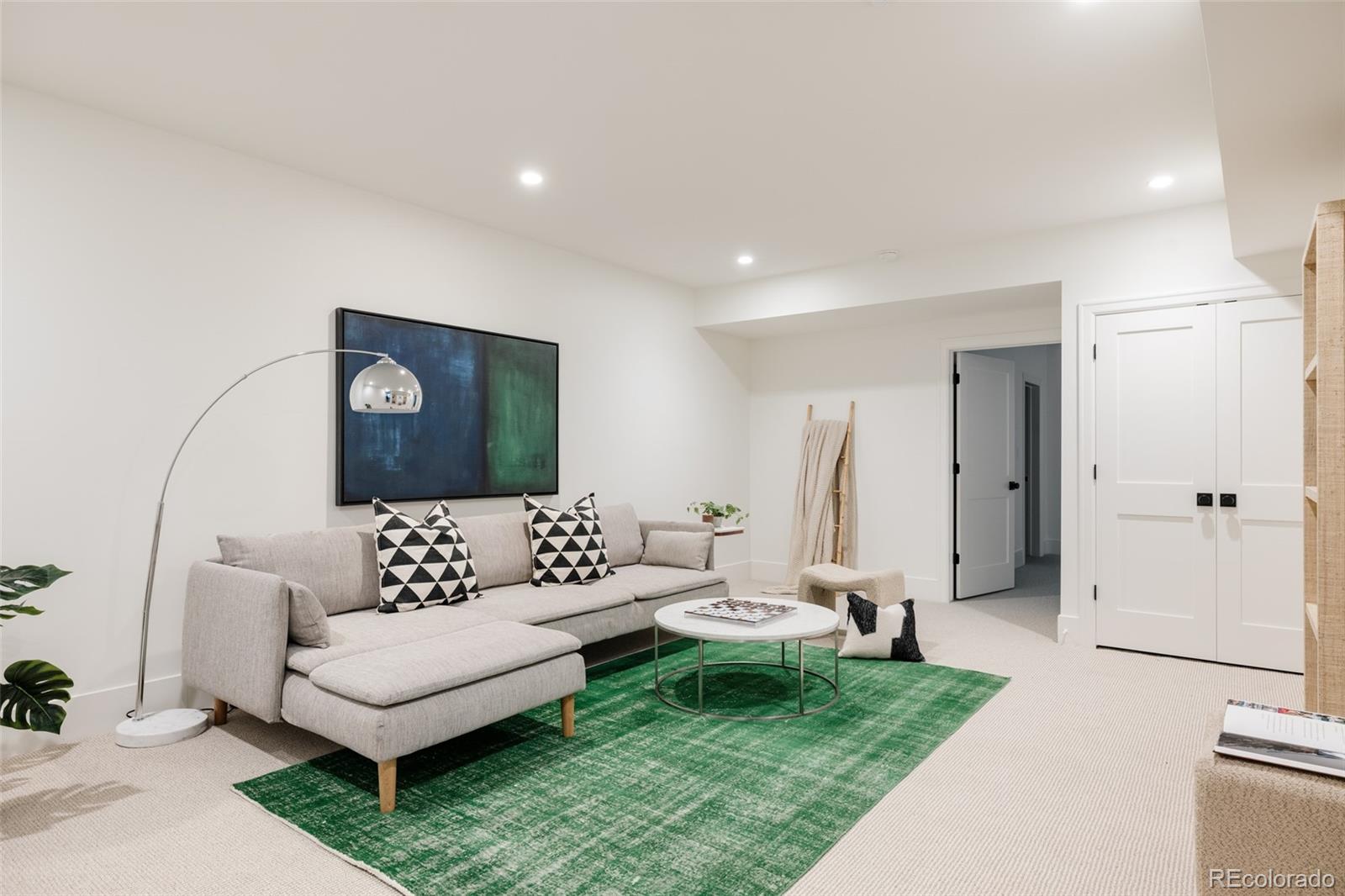 4131 Quivas Street Denver, CO 80211 - Photo 35 of 44 a living room with furniture and a rug