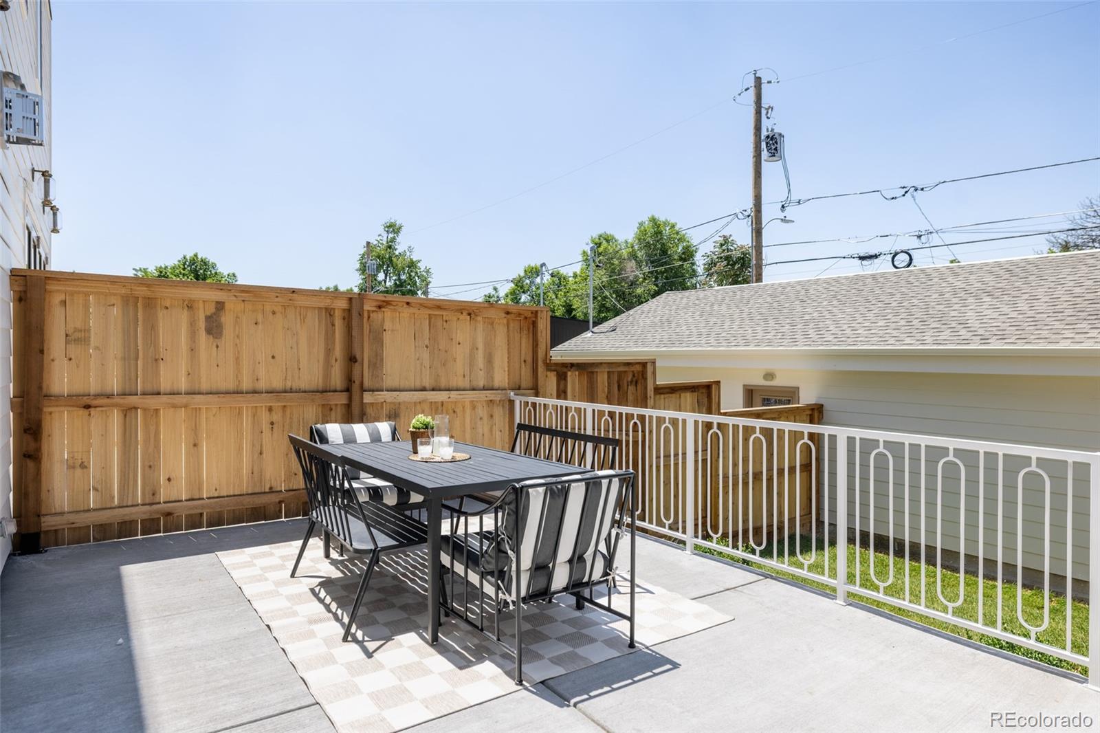4131 Quivas Street Denver, CO 80211 - Photo 41 of 44 a view of a roof deck with table and chairs