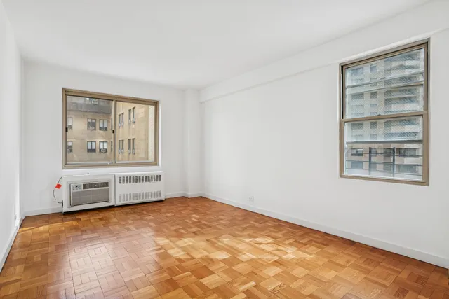 a kitchen with granite countertop a sink stove and cabinets