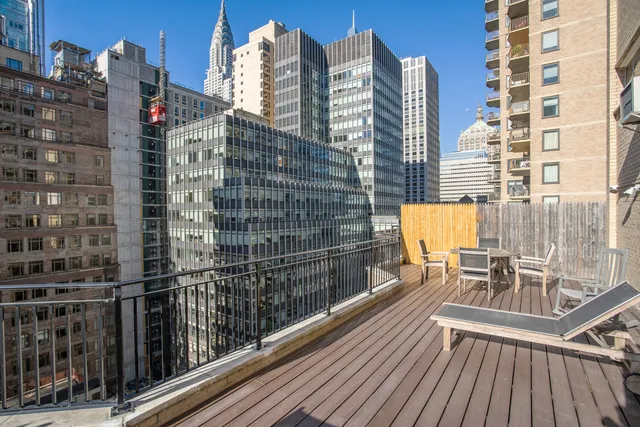 a bathroom with a sink a toilet a mirror a bathtub and shower