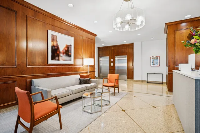 a view of a balcony with a table and chairs