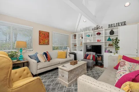 a living room with furniture and a table