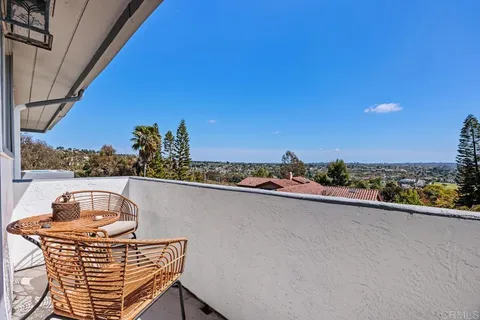 a view of a balcony with city view