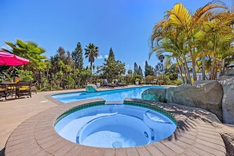 a view of a swimming pool with a patio