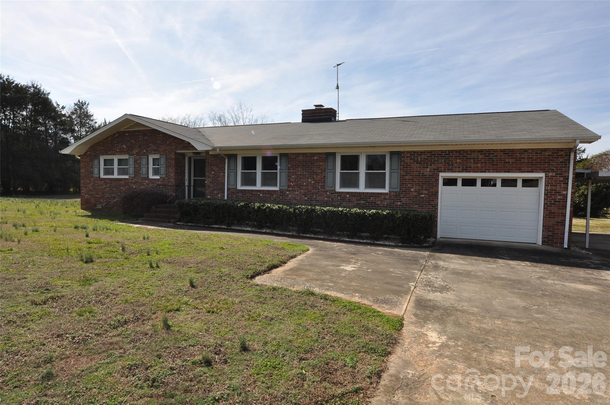 a front view of a house with yard
