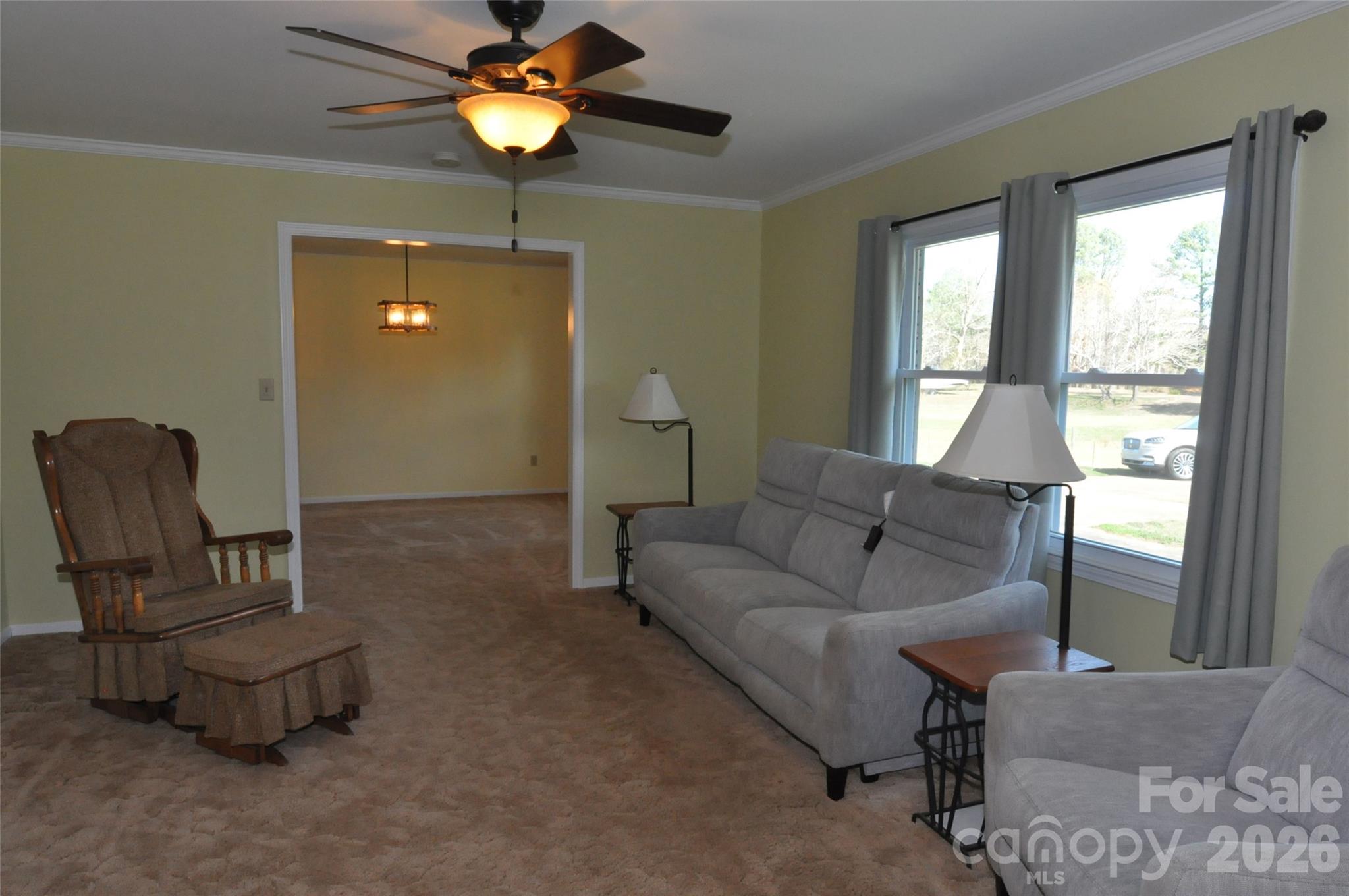 1316 Cornwell Road Blackstock, SC 29014 - Photo 11 of 48 a living room with furniture and a chandelier