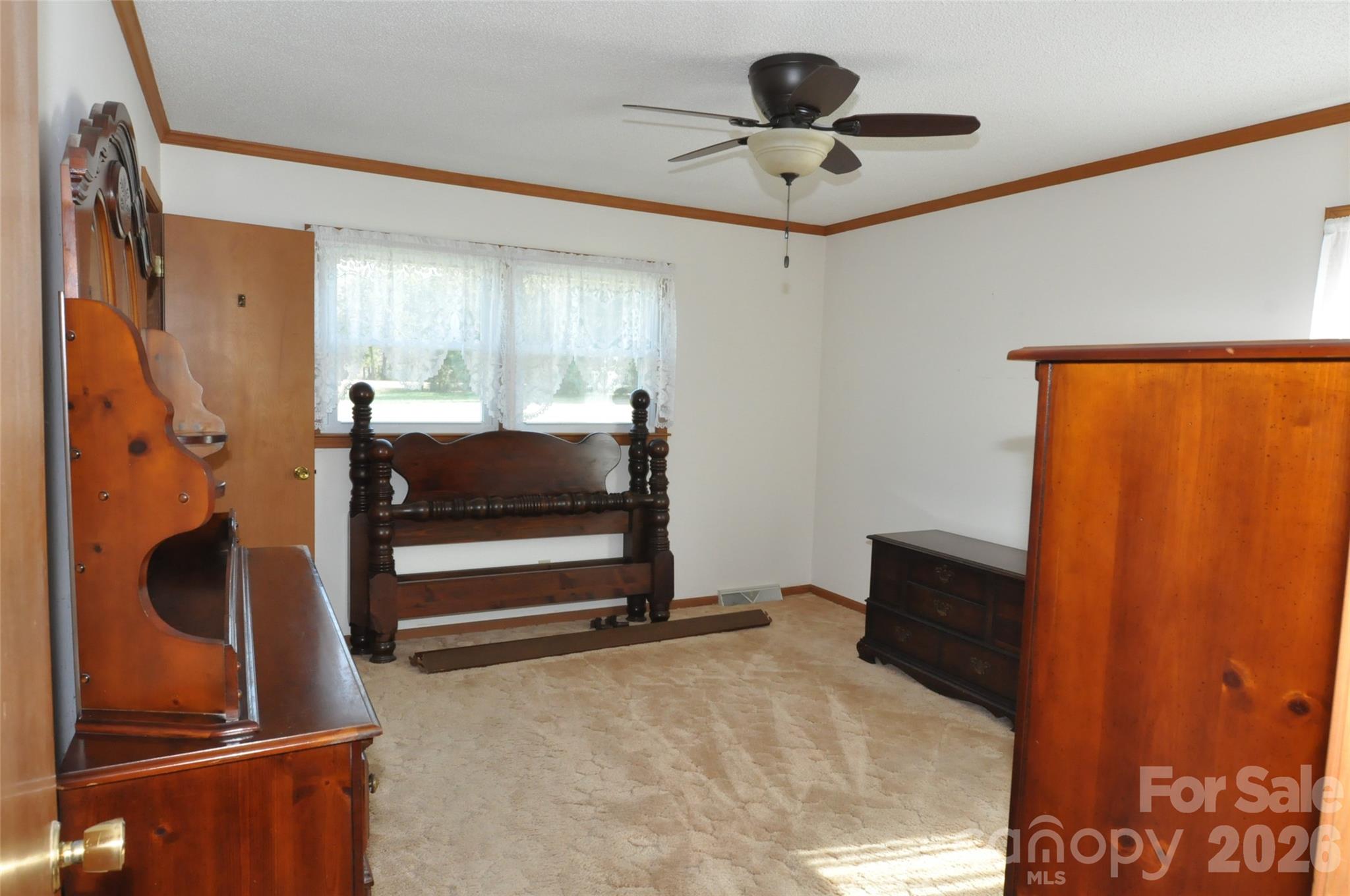 1316 Cornwell Road Blackstock, SC 29014 - Photo 13 of 48 a bedroom with a bed and a ceiling fan