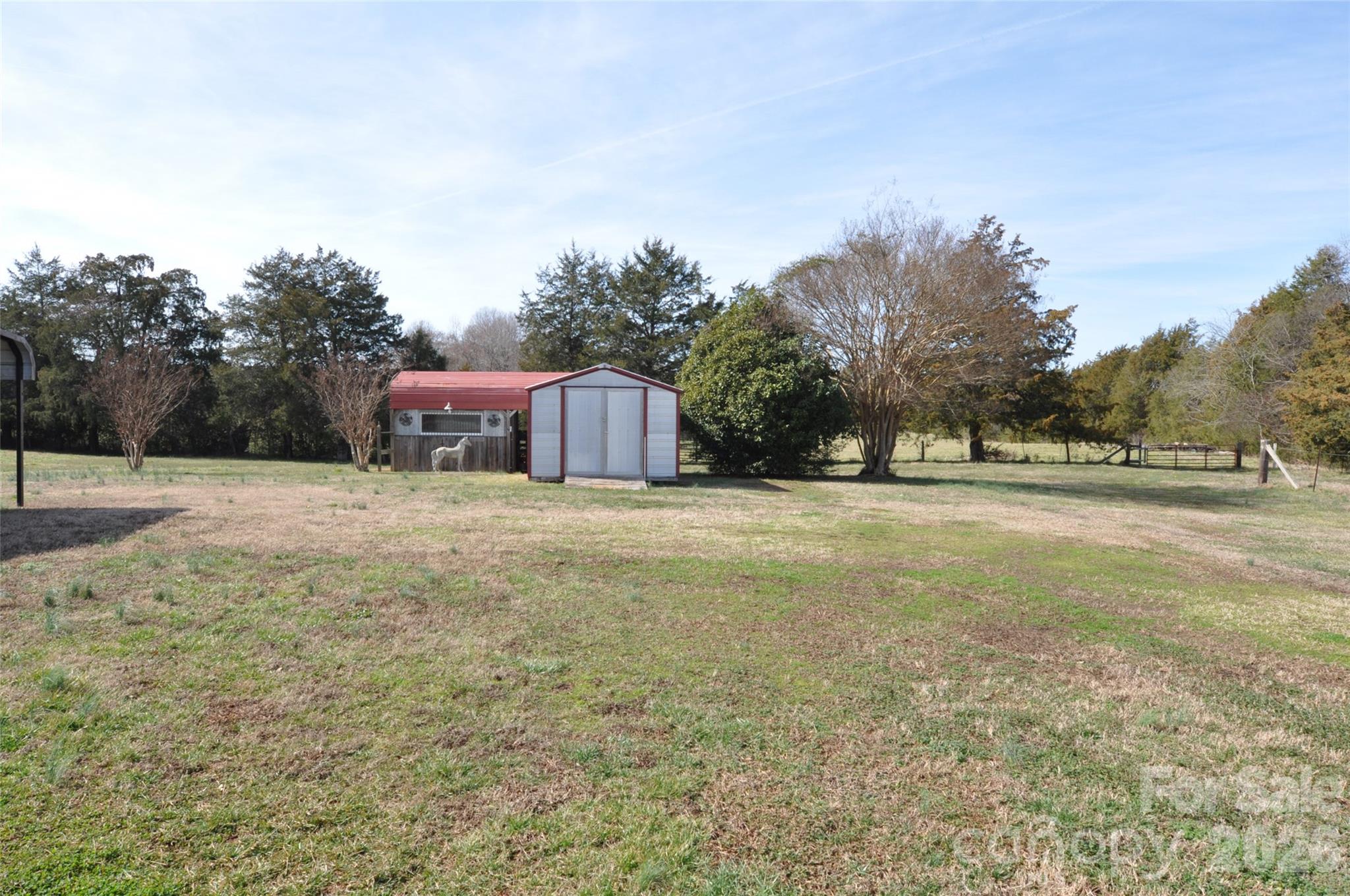 1316 Cornwell Road Blackstock, SC 29014 - Photo 24 of 48 a view of a house with yard and trees