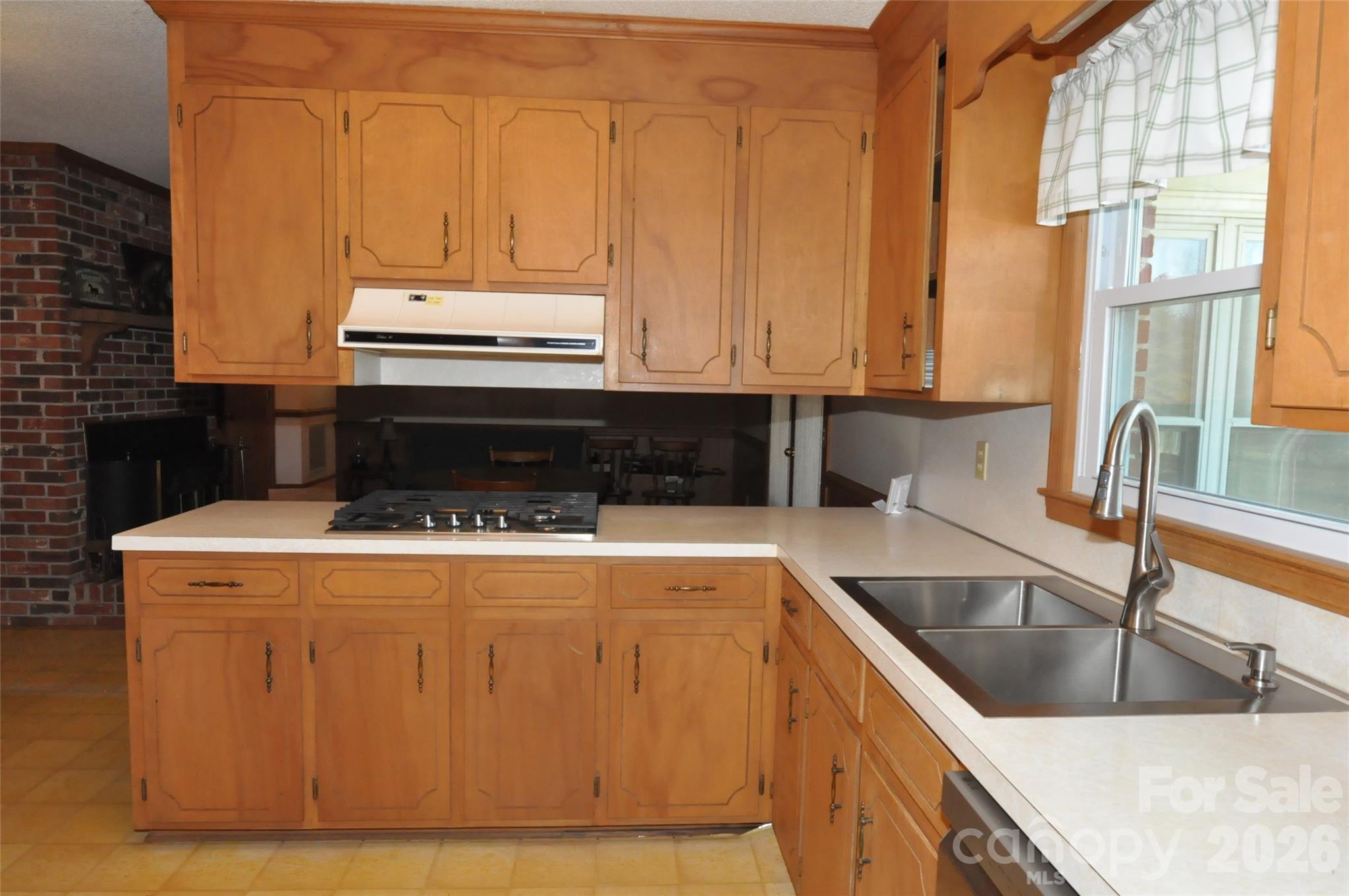 1316 Cornwell Road Blackstock, SC 29014 - Photo 7 of 48 a kitchen with granite countertop a sink a stove and cabinets
