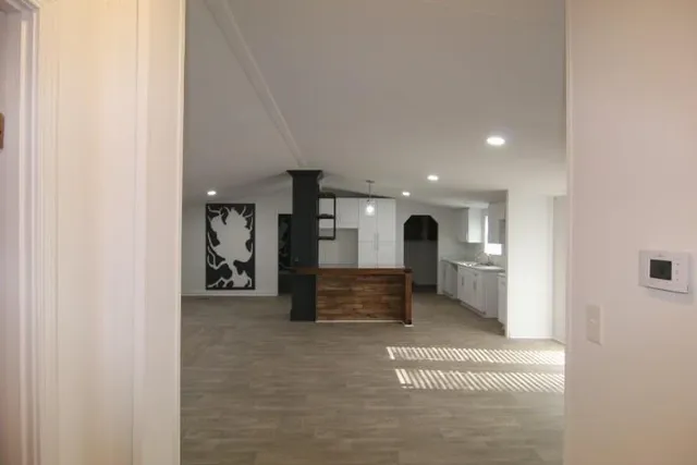 a view of game room with furniture and window